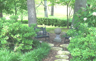A place to sit and think while enjoying the azaleas and oak leaf hydrangeas