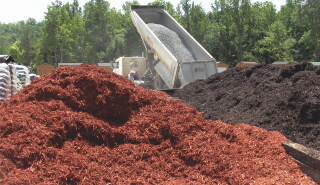 For large areas, you may purchase hardwood mulch by the truck load, picked up or delivered